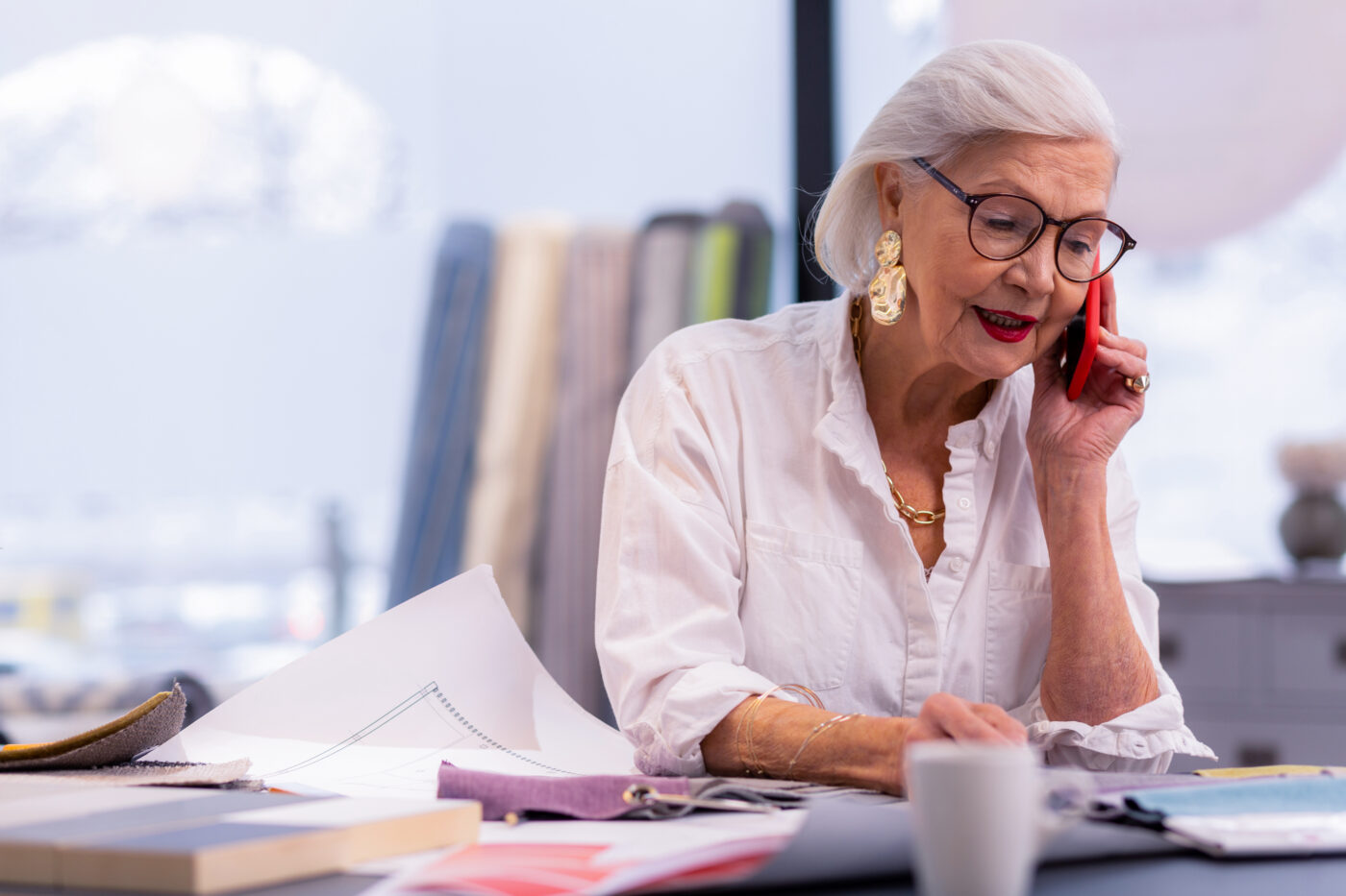 Woman working front desk after retiring